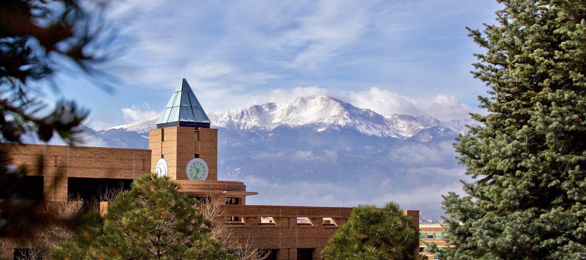 Snow graces the top of Pikes Peak, which looks over UCCS and its campus.